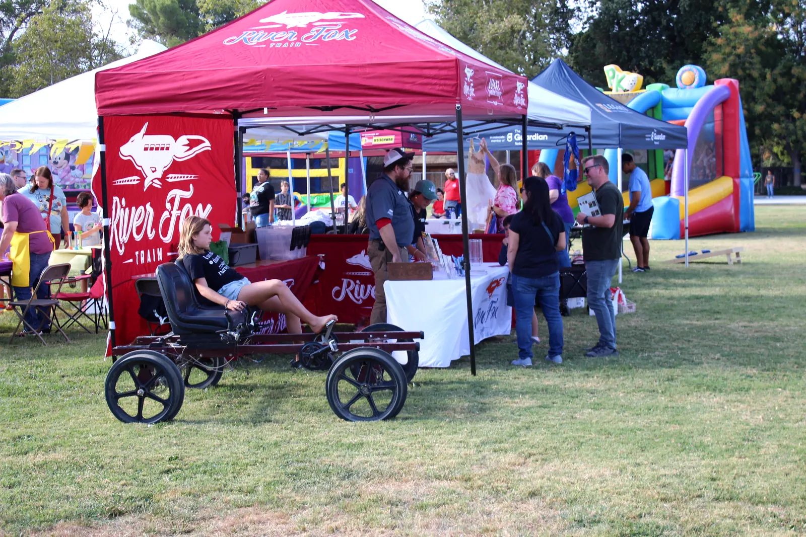 A local Davis business booth serving guests at a community event